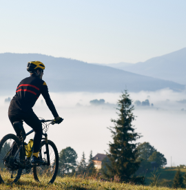 male-cyclist-riding-bicycle-mountains