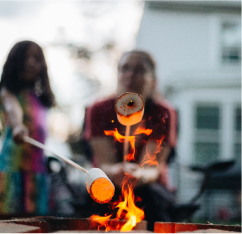 mother-and-daughter-outdoors-roasting-marshmallow